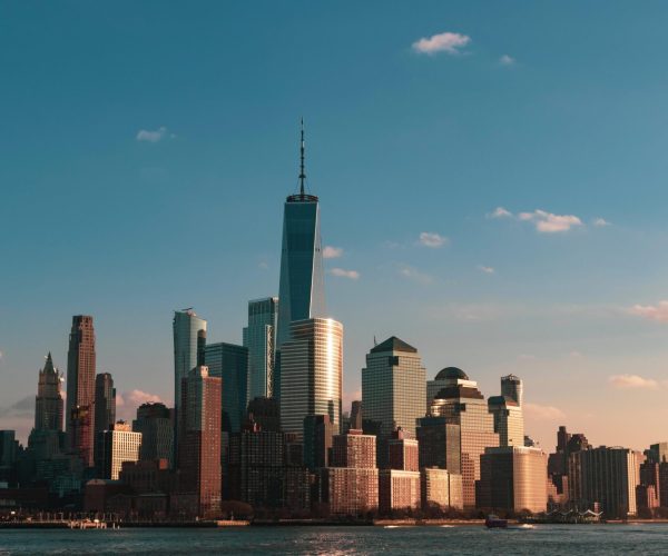 A beautiful cityscape with tall skyscrapers near the sea in New York City, USA